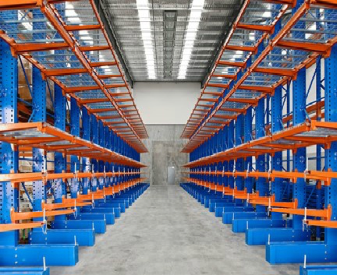 Rows of orange and blue warehouse shelving