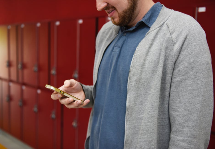 man-next-to-lockers.png